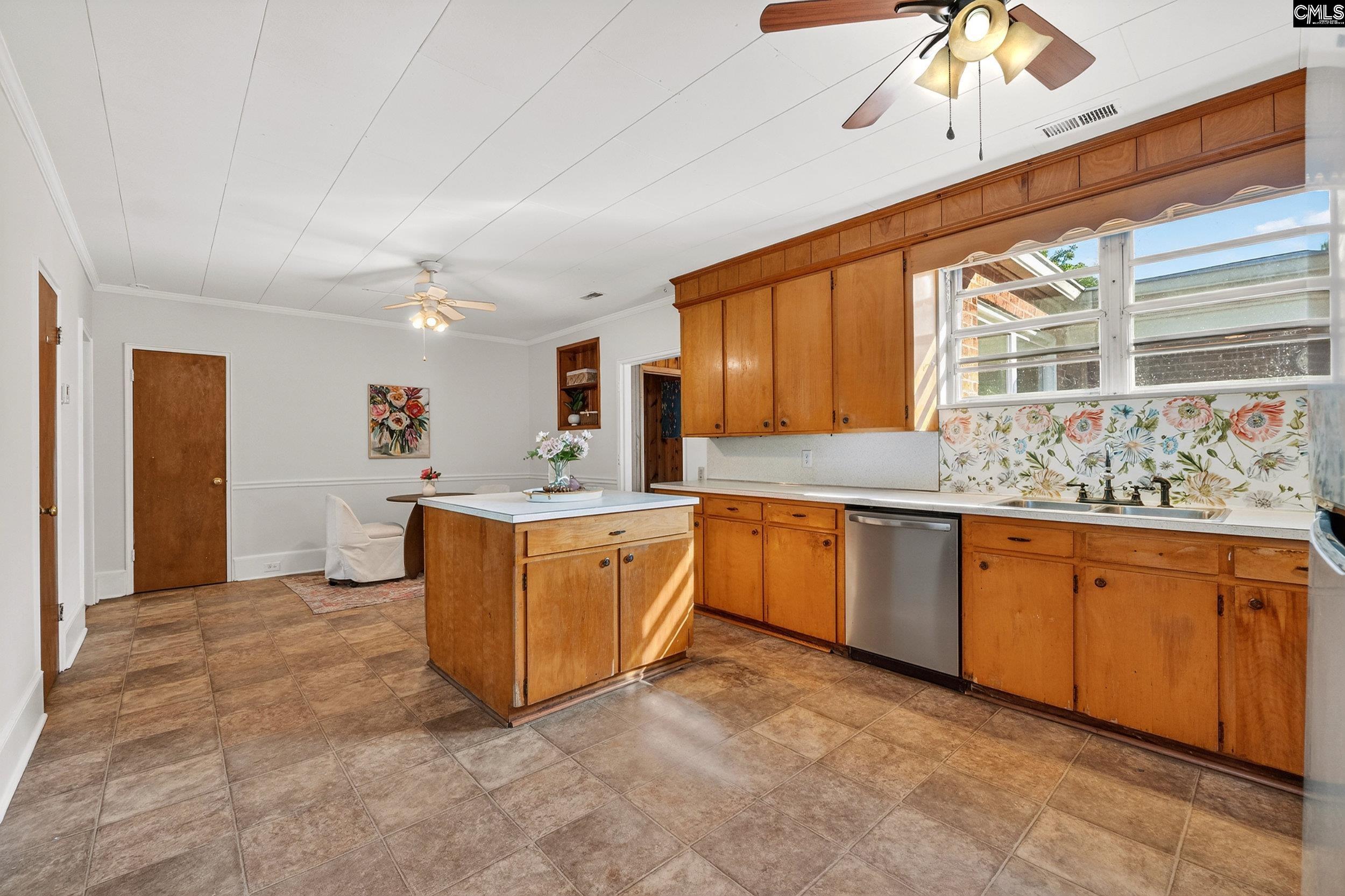 729 Magnolia Street Pelion, SC 29123 - Photo 6 of 32 a large kitchen with stainless steel appliances granite countertop a sink and cabinets