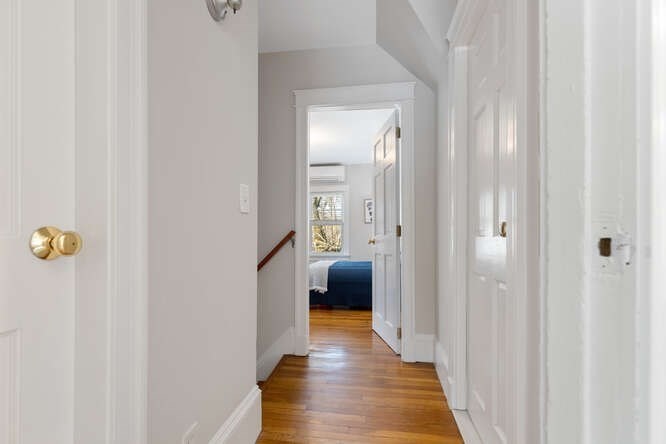 15 Maple Street Melrose, MA 02176 - Photo 18 of 38 a view of a hallway with wooden floor and closet