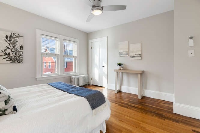 15 Maple Street Melrose, MA 02176 - Photo 20 of 38 a bedroom with a bed and a window