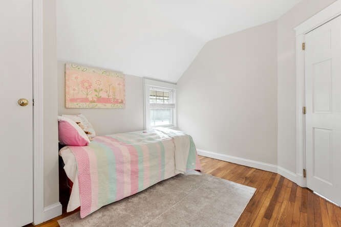 15 Maple Street Melrose, MA 02176 - Photo 24 of 38 a bedroom with a bed and a window