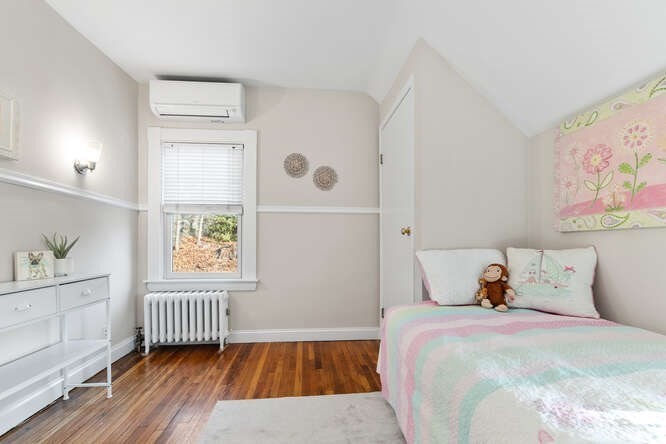15 Maple Street Melrose, MA 02176 - Photo 26 of 38 a bedroom with a bed and a window in it