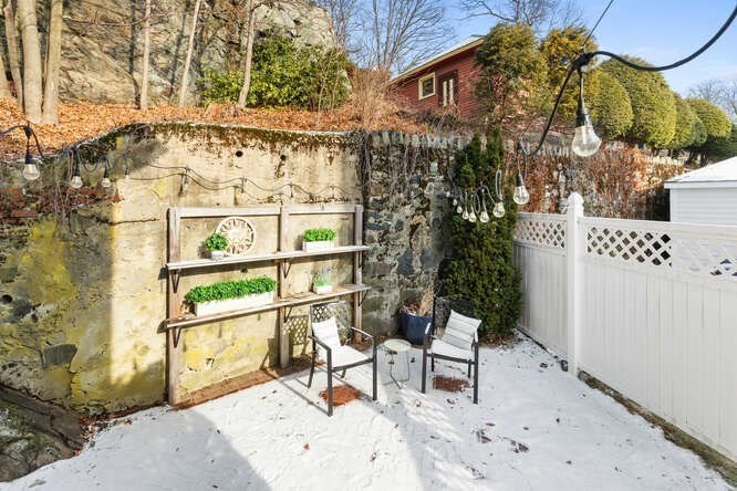 15 Maple Street Melrose, MA 02176 - Photo 29 of 38 a view of a chairs and table in the backyard