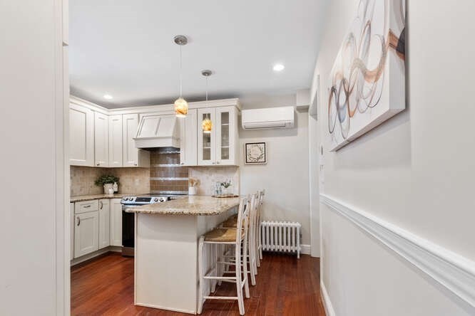 15 Maple Street Melrose, MA 02176 - Photo 4 of 38 a kitchen with stainless steel appliances a sink and cabinets