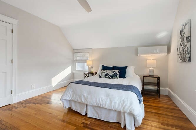 15 Maple Street Melrose, MA 02176 - Photo 9 of 38 a bedroom with a bed and wooden floor