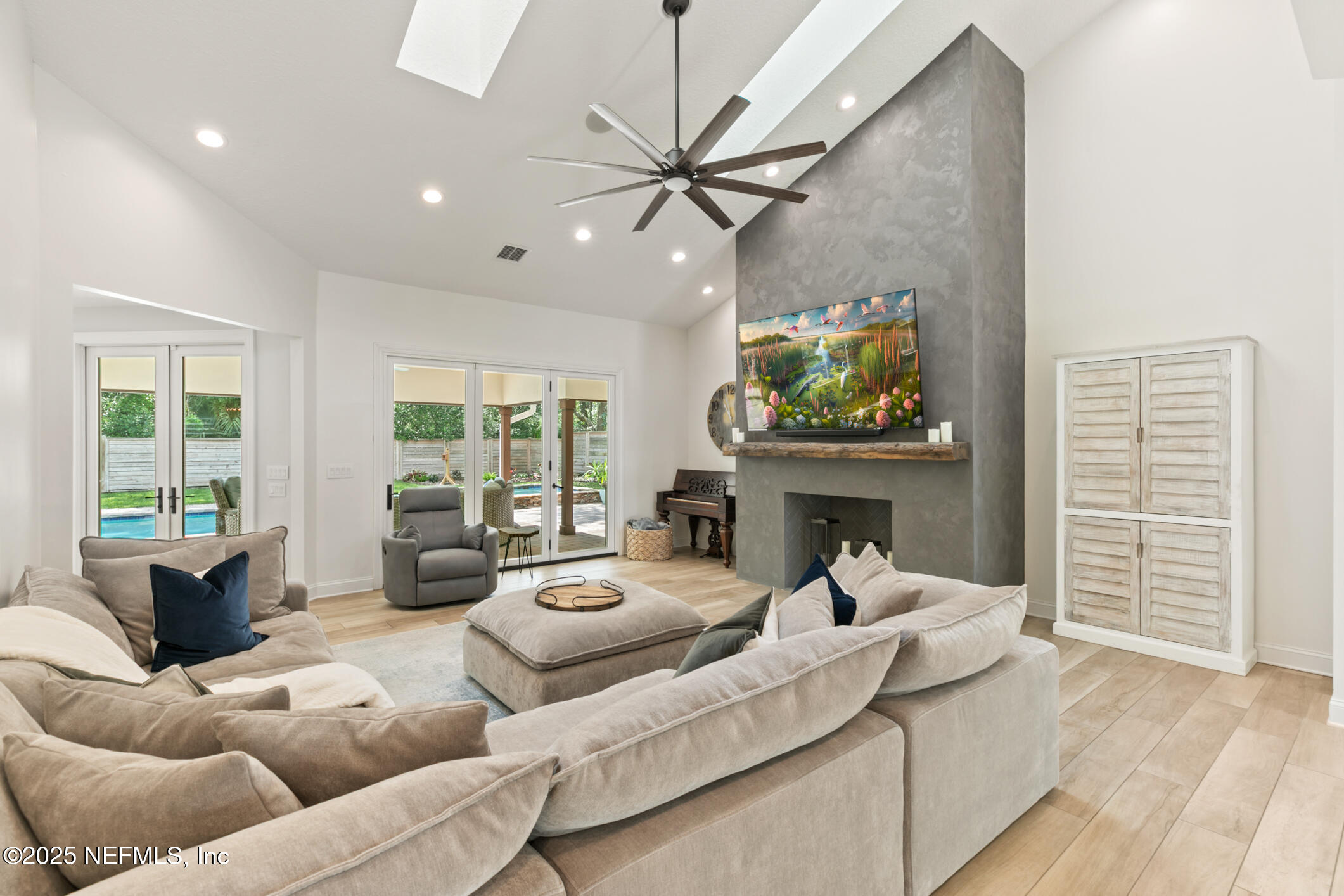 2341 Fiddlers Lane Atlantic Beach, FL 32233 - Photo 11 of 87 a living room with furniture a fireplace and a large window