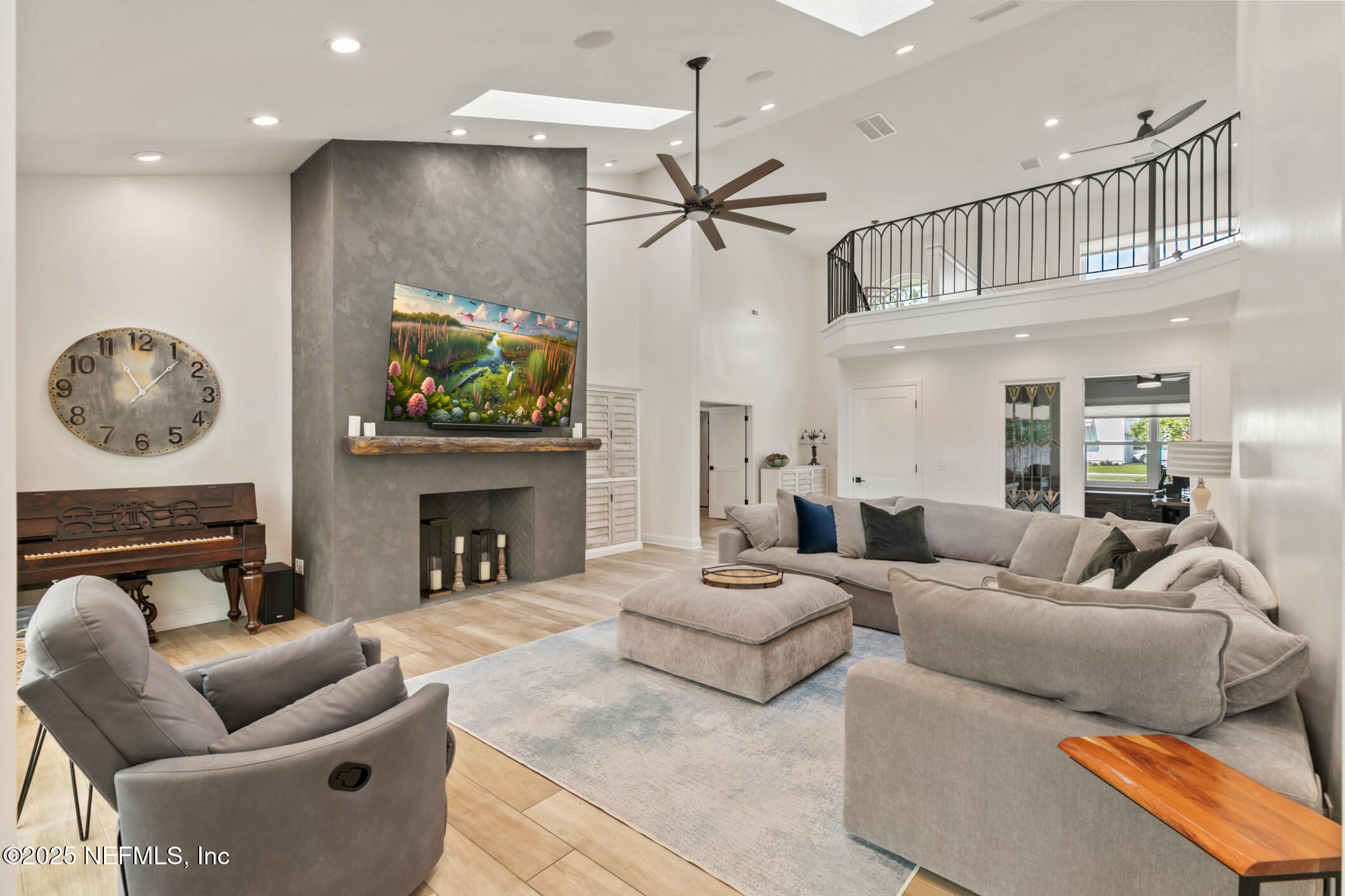 2341 Fiddlers Lane Atlantic Beach, FL 32233 - Photo 12 of 87 a living room with furniture a fireplace and a chandelier