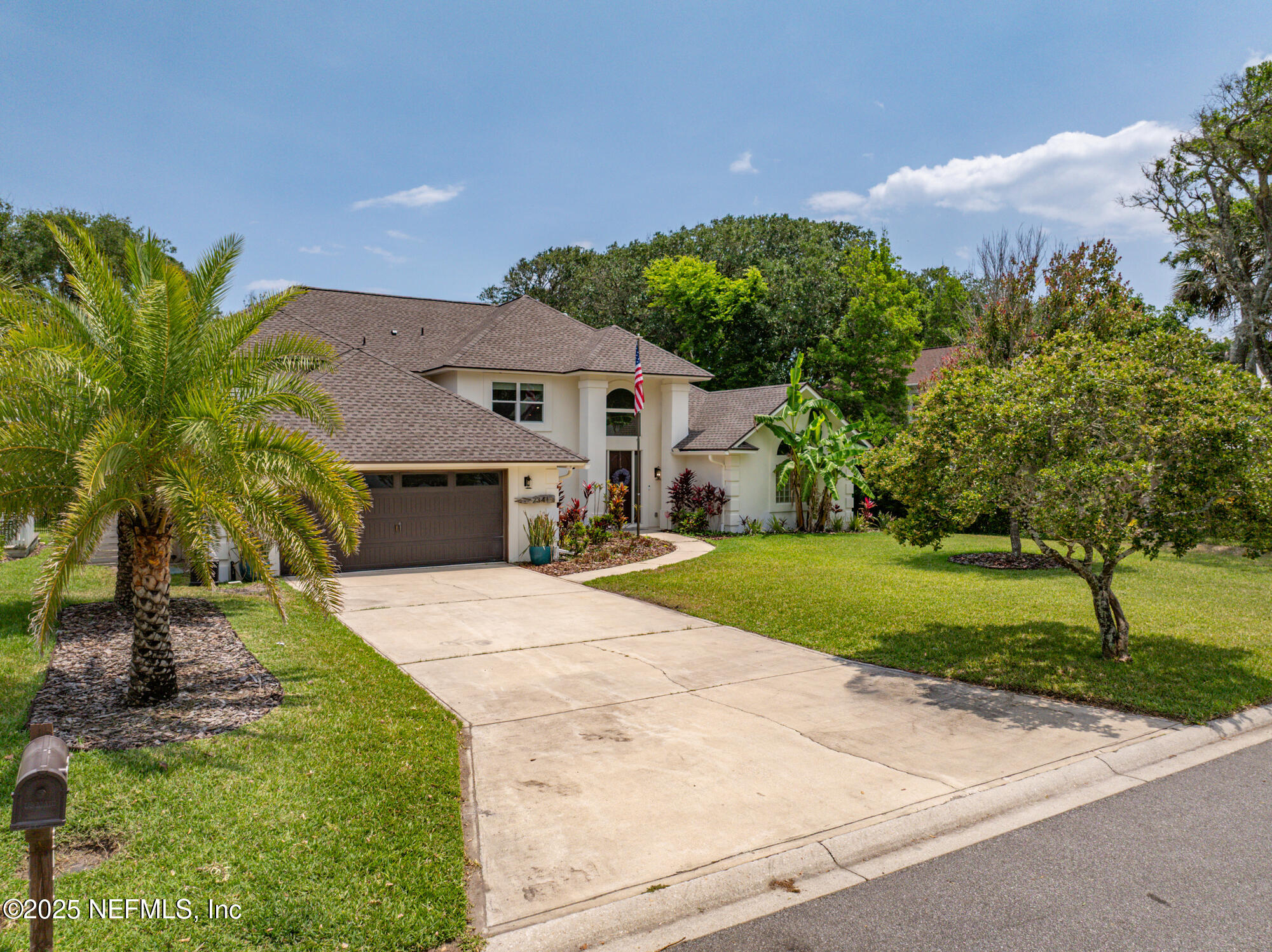 2341 Fiddlers Lane Atlantic Beach, FL 32233 - Photo 2 of 87 a front view of a house with garden