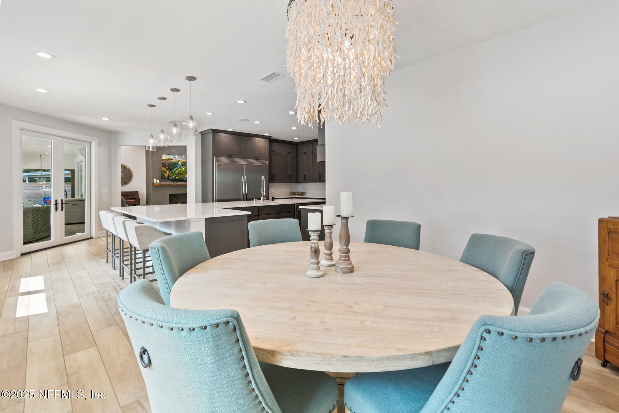 2341 Fiddlers Lane Atlantic Beach, FL 32233 - Photo 25 of 87 a dining room with furniture a chandelier and kitchen view
