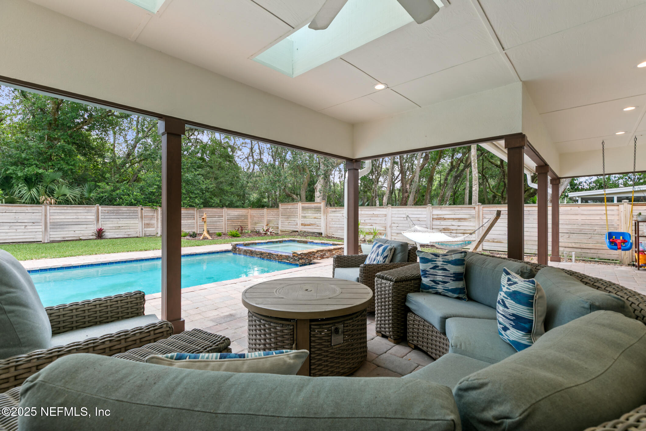 2341 Fiddlers Lane Atlantic Beach, FL 32233 - Photo 64 of 87 a living room with couch and a floor to ceiling window