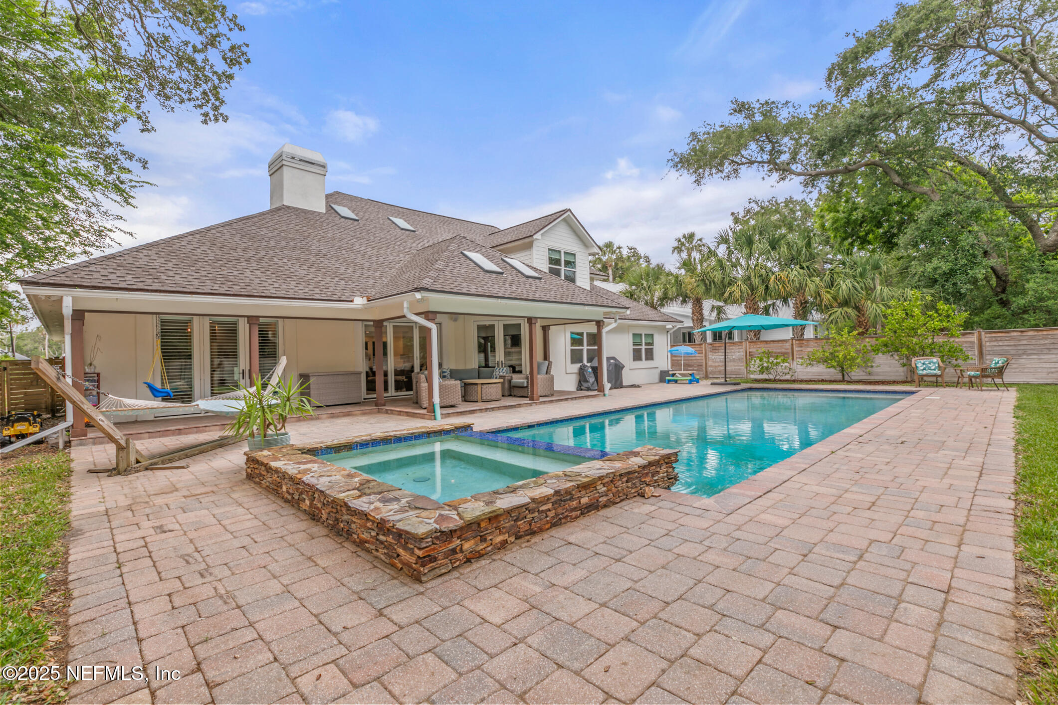 2341 Fiddlers Lane Atlantic Beach, FL 32233 - Photo 69 of 87 a front view of house with yard slide and outdoor seating