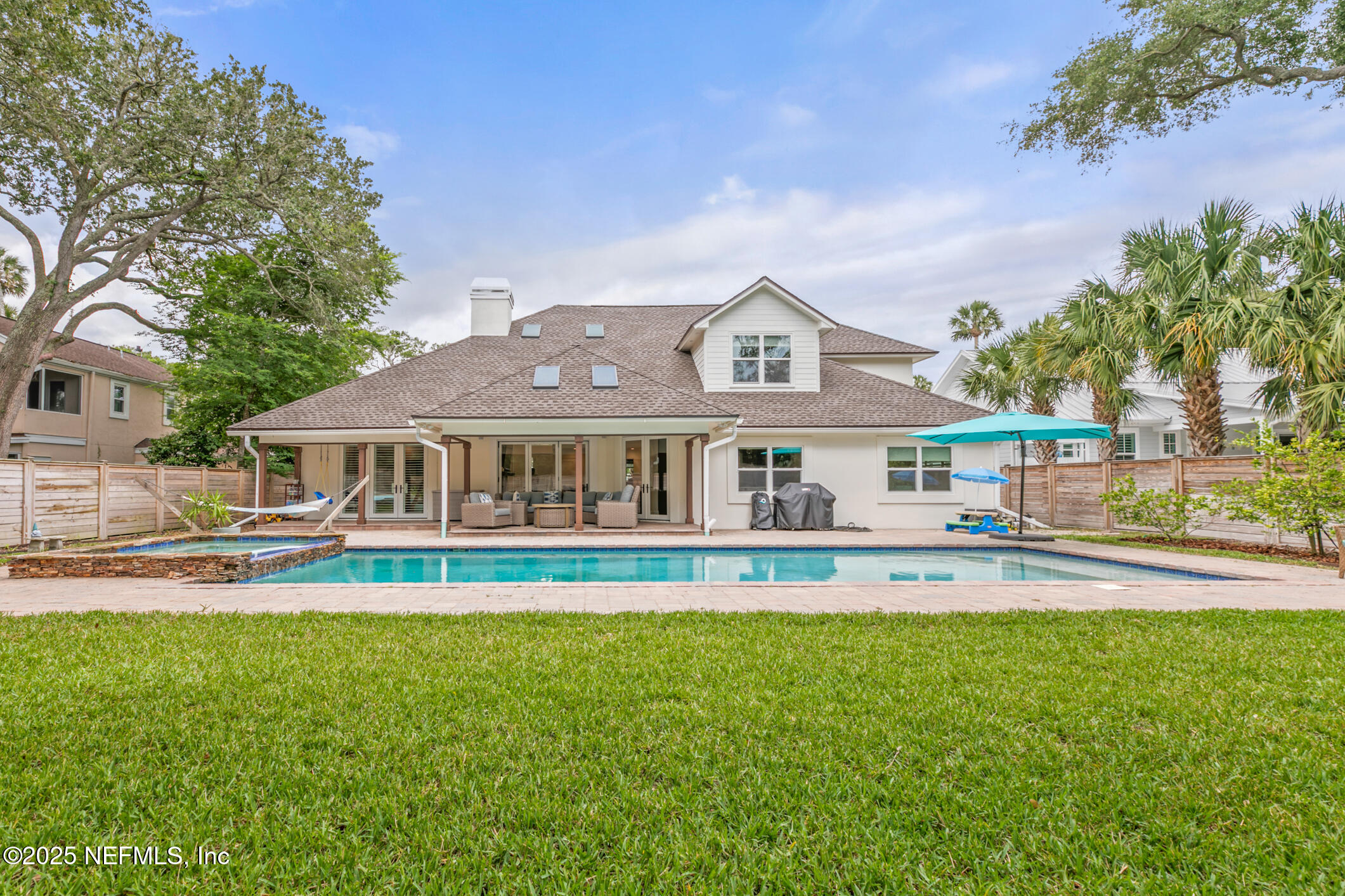2341 Fiddlers Lane Atlantic Beach, FL 32233 - Photo 70 of 87 a front view of a house with a garden