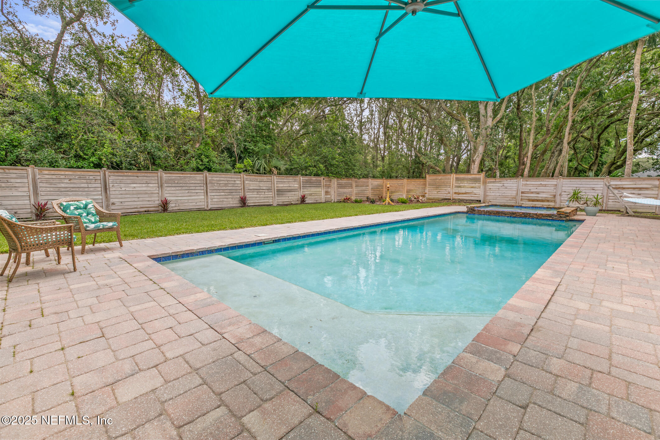 2341 Fiddlers Lane Atlantic Beach, FL 32233 - Photo 73 of 87 a view of a swimming pool with a patio and a yard