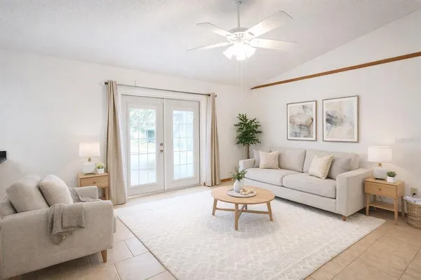 a living room with furniture and a large window