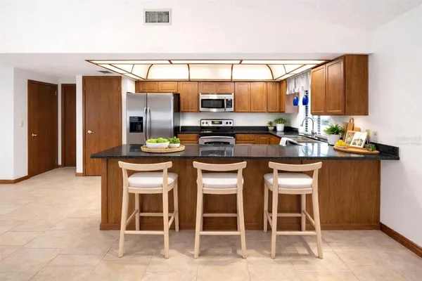 a kitchen with a sink cabinets and counter space