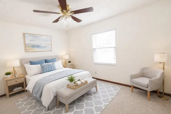 a bedroom with a bed and a couch