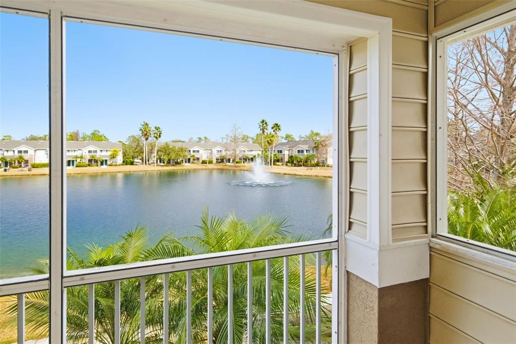 8933 Manor Loop, Unit 205 Lakewood Ranch, FL 34202 - Photo 36 of 76 a view of a glass door with a lake view