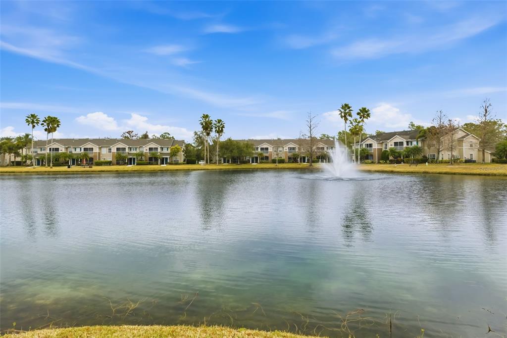 8933 Manor Loop, Unit 205 Lakewood Ranch, FL 34202 - Photo 38 of 76 a view of a lake with boats and trees in the background