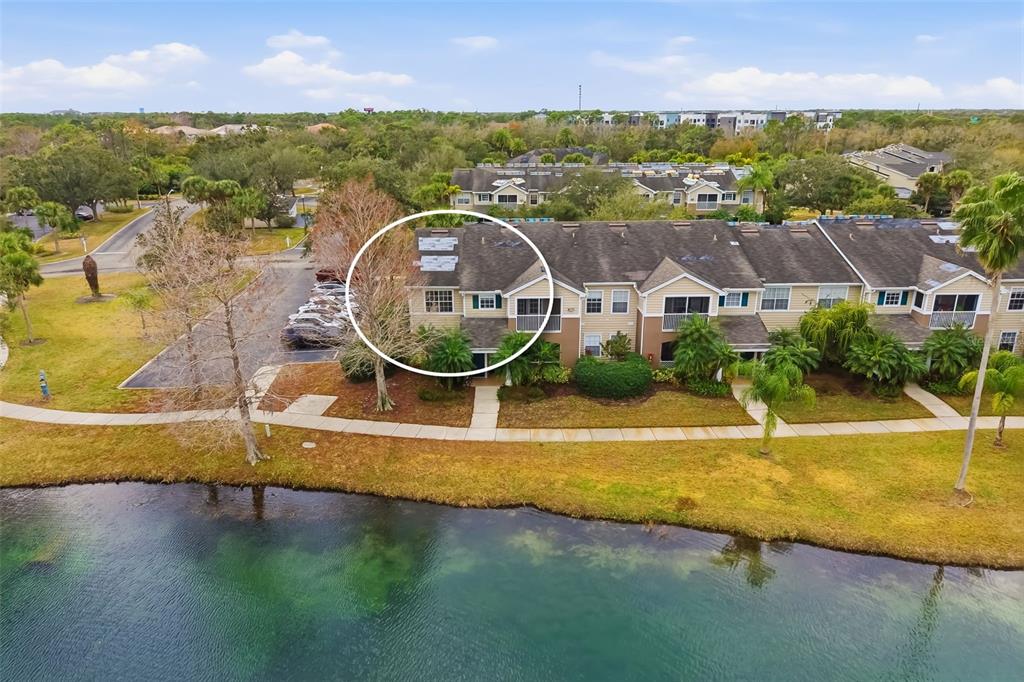 8933 Manor Loop, Unit 205 Lakewood Ranch, FL 34202 - Photo 41 of 76 an aerial view of residential houses with outdoor space and swimming pool