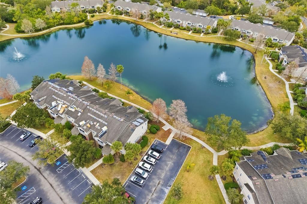 8933 Manor Loop, Unit 205 Lakewood Ranch, FL 34202 - Photo 44 of 76 an aerial view of a house with a lake view