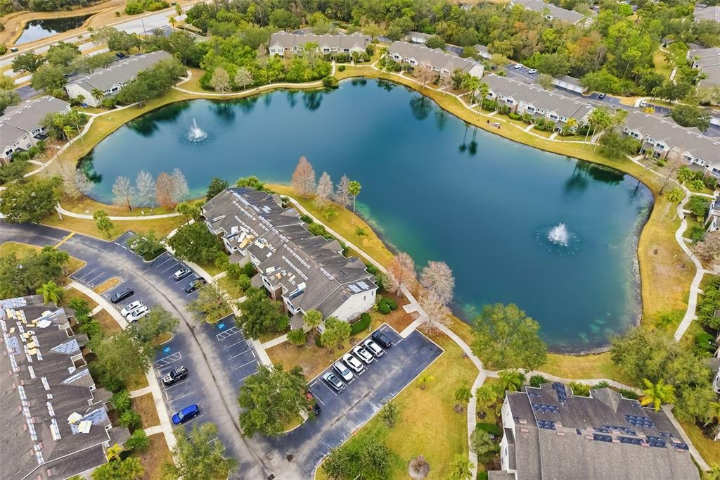 8933 Manor Loop, Unit 205 Lakewood Ranch, FL 34202 - Photo 45 of 76 an aerial view of a house a yard and a fountain