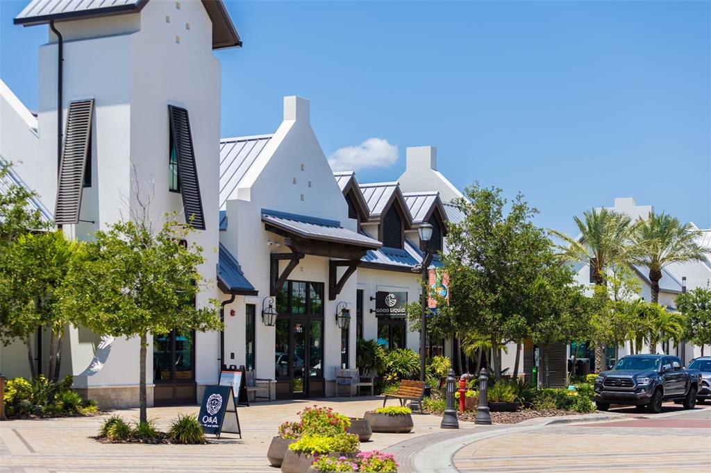 8933 Manor Loop, Unit 205 Lakewood Ranch, FL 34202 - Photo 68 of 76 a front view of a building with tree s
