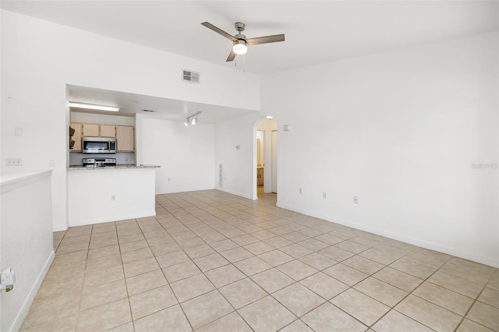 8933 Manor Loop, Unit 205 Lakewood Ranch, FL 34202 - Photo 7 of 76 a view of a kitchen with a sink and cabinets