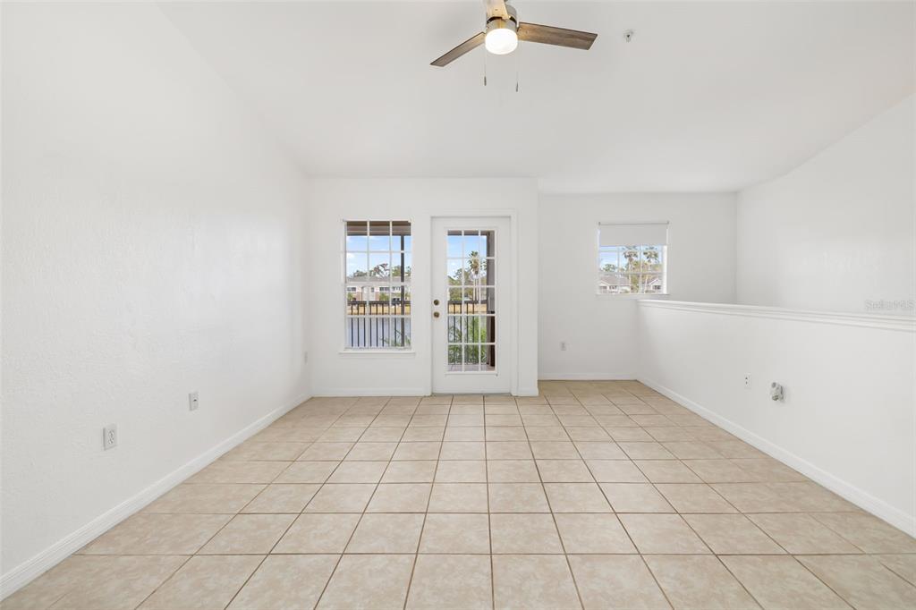 8933 Manor Loop, Unit 205 Lakewood Ranch, FL 34202 - Photo 9 of 76 a view of an empty room with a window