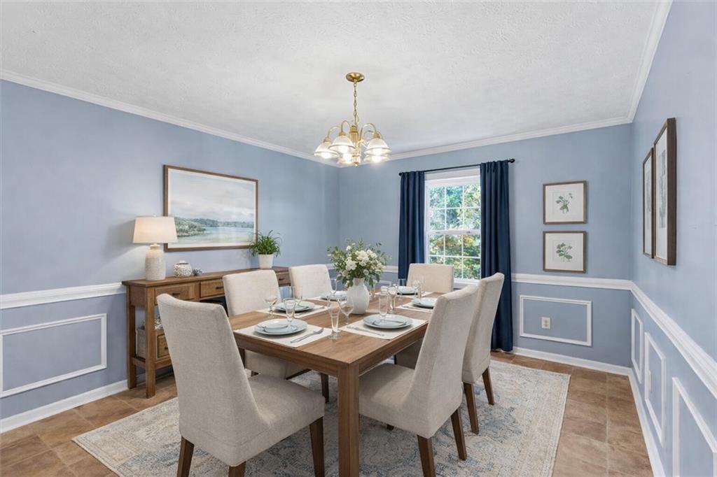 1500 Moores Ferry Road Southwest Plainville, GA 30733 - Photo 5 of 33 a dining room with furniture a rug and a chandelier