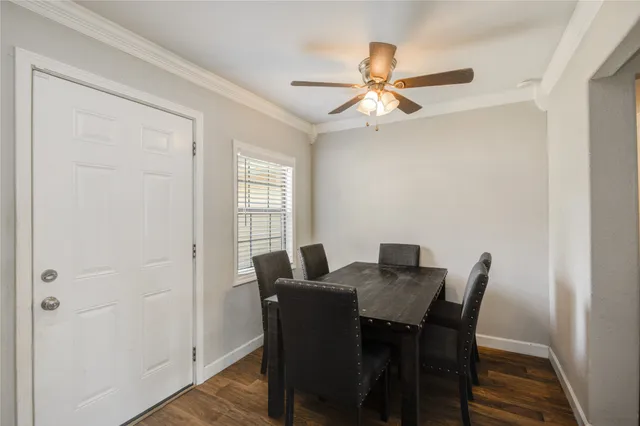 a view of a dining room with furniture and wooden floor