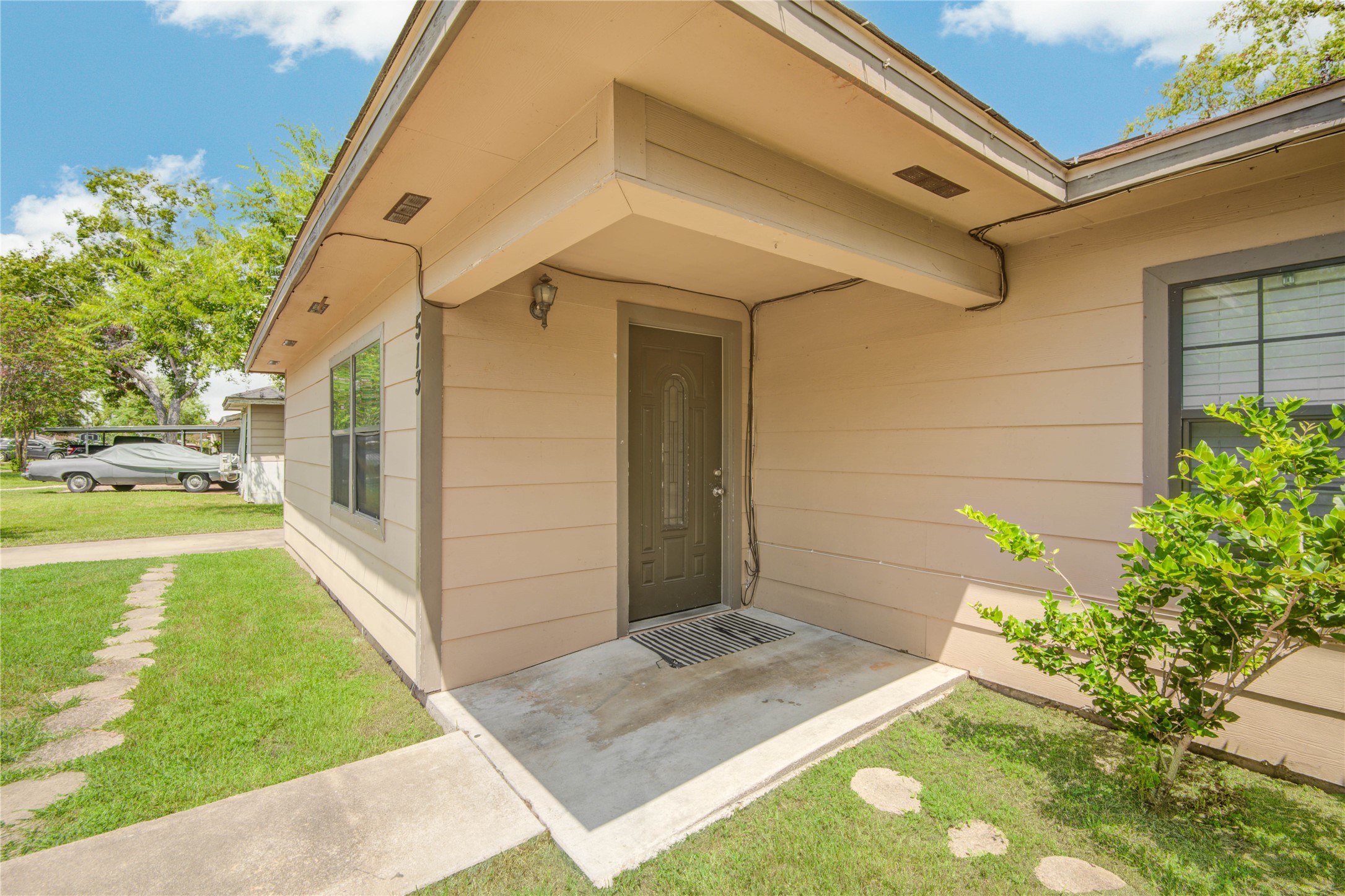 513 Farrer Street Angleton, TX 77515 - Photo 4 of 32 a front view of a house with garden