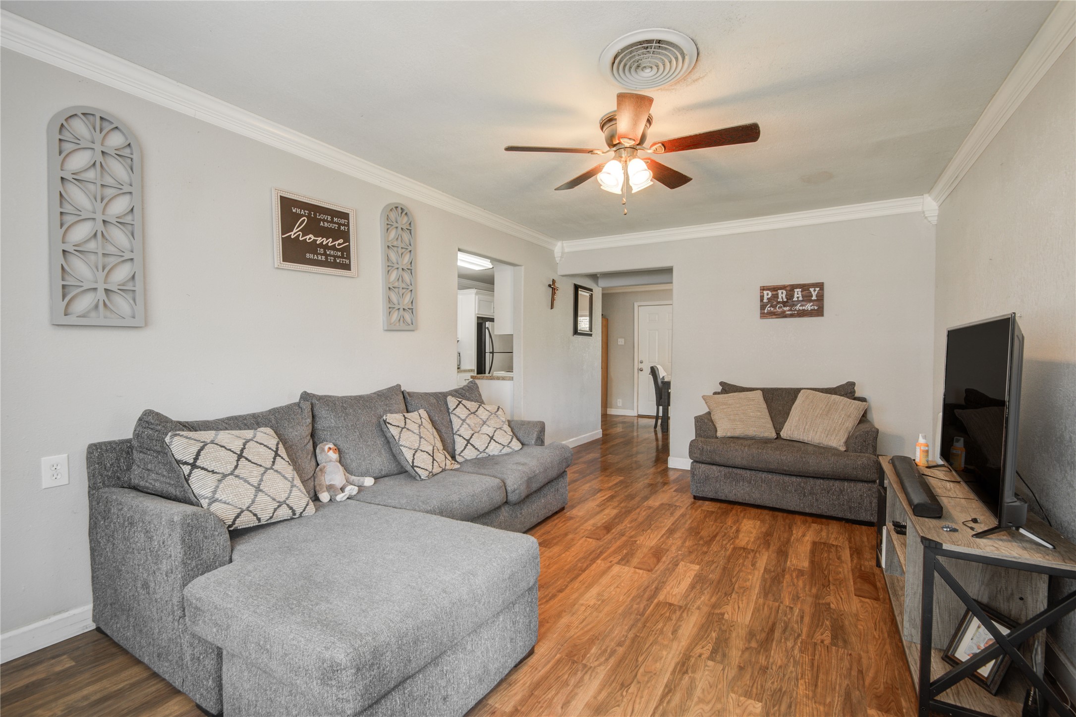 513 Farrer Street Angleton, TX 77515 - Photo 5 of 32 a living room with furniture and a flat screen tv