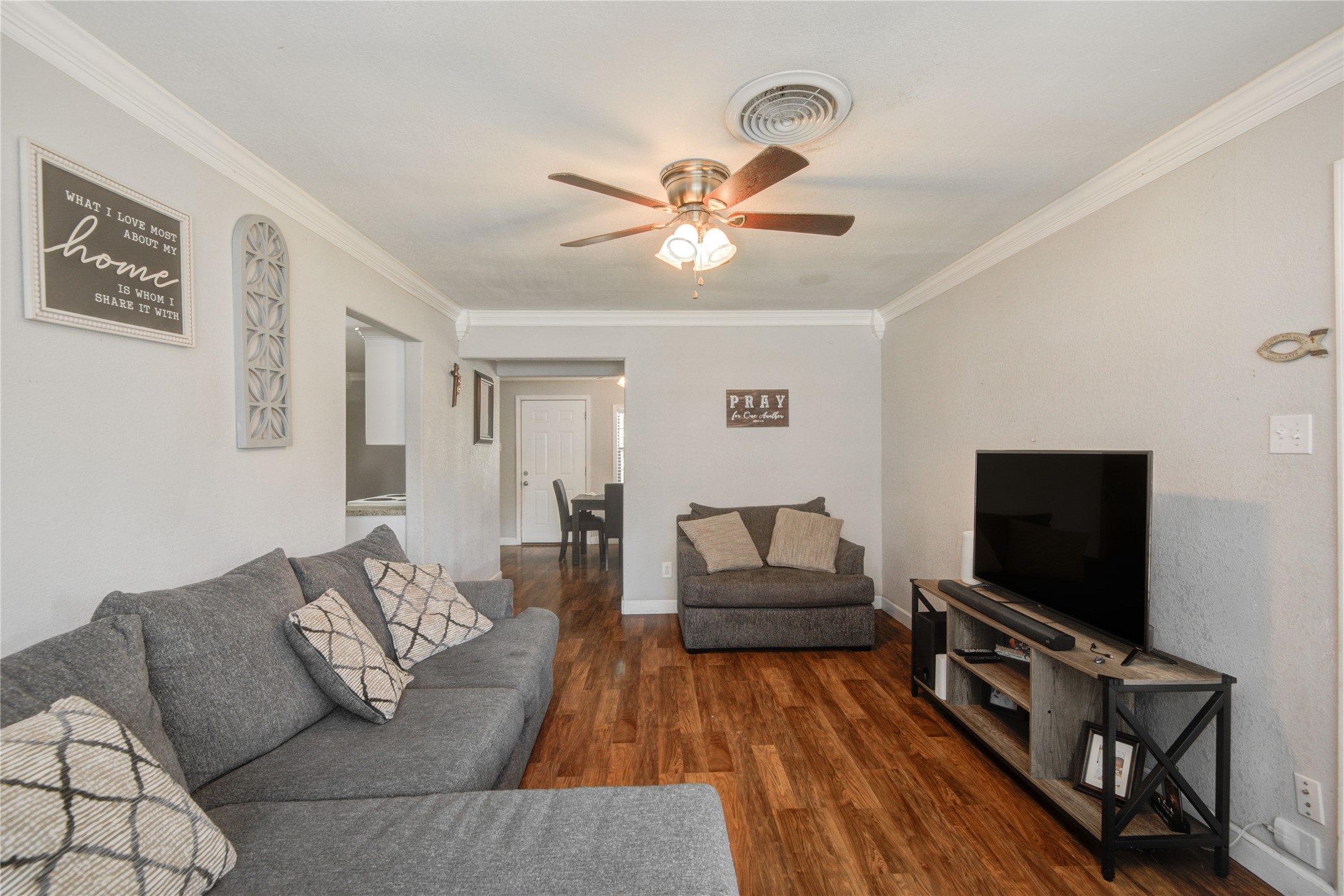 513 Farrer Street Angleton, TX 77515 - Photo 6 of 32 a living room with furniture and a flat screen tv