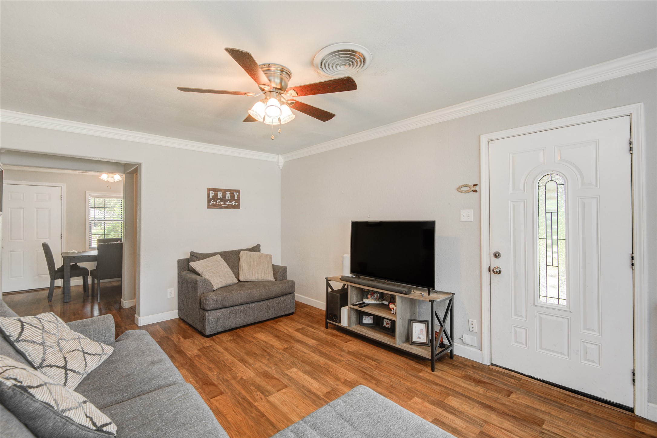 513 Farrer Street Angleton, TX 77515 - Photo 7 of 32 a living room with furniture and a flat screen tv
