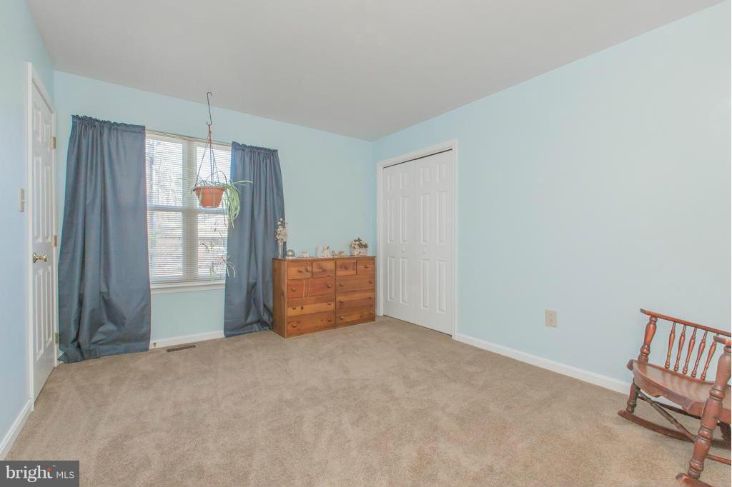 11360 Commanche Road Lusby, MD 20657 - Photo 22 of 29 a view of an empty room with a window