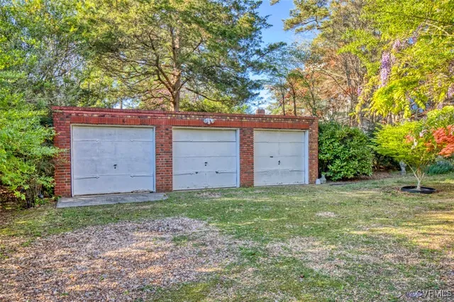 a kitchen with granite countertop a refrigerator and a sink