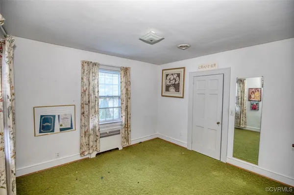a view of storage and utility room with closet