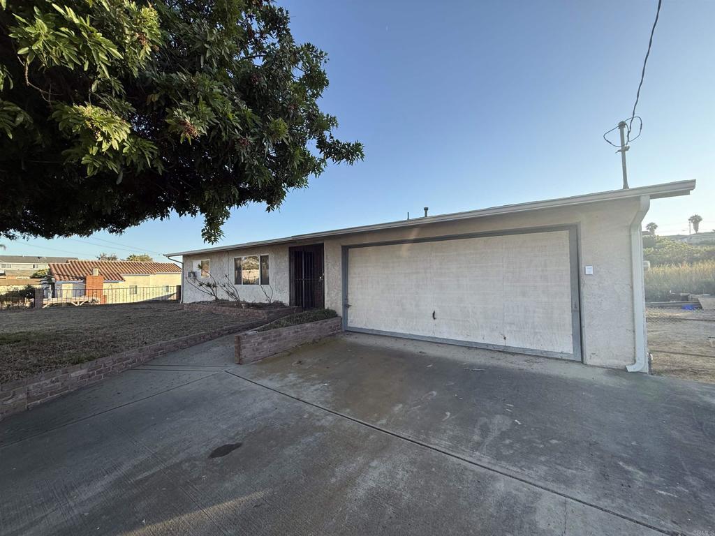 2220 Rachael Avenue National City, CA 91950 - Photo 3 of 26 a view of a house with a yard and garage