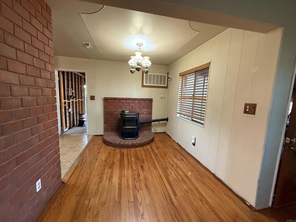 2220 Rachael Avenue National City, CA 91950 - Photo 7 of 26 a view of livingroom with hardwood floor and a ceiling fan