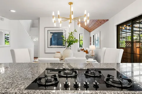a kitchen with stainless steel appliances a refrigerator sink and stove