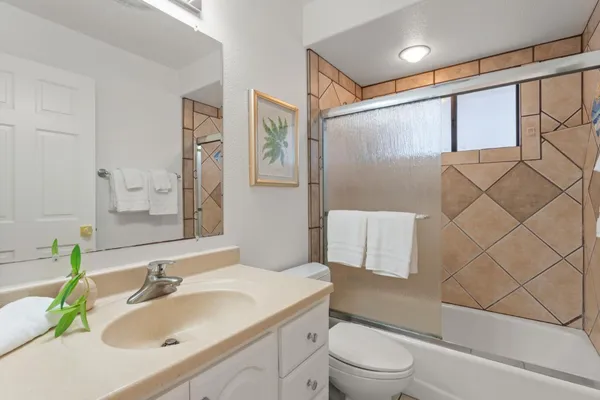 a bedroom with bed and window