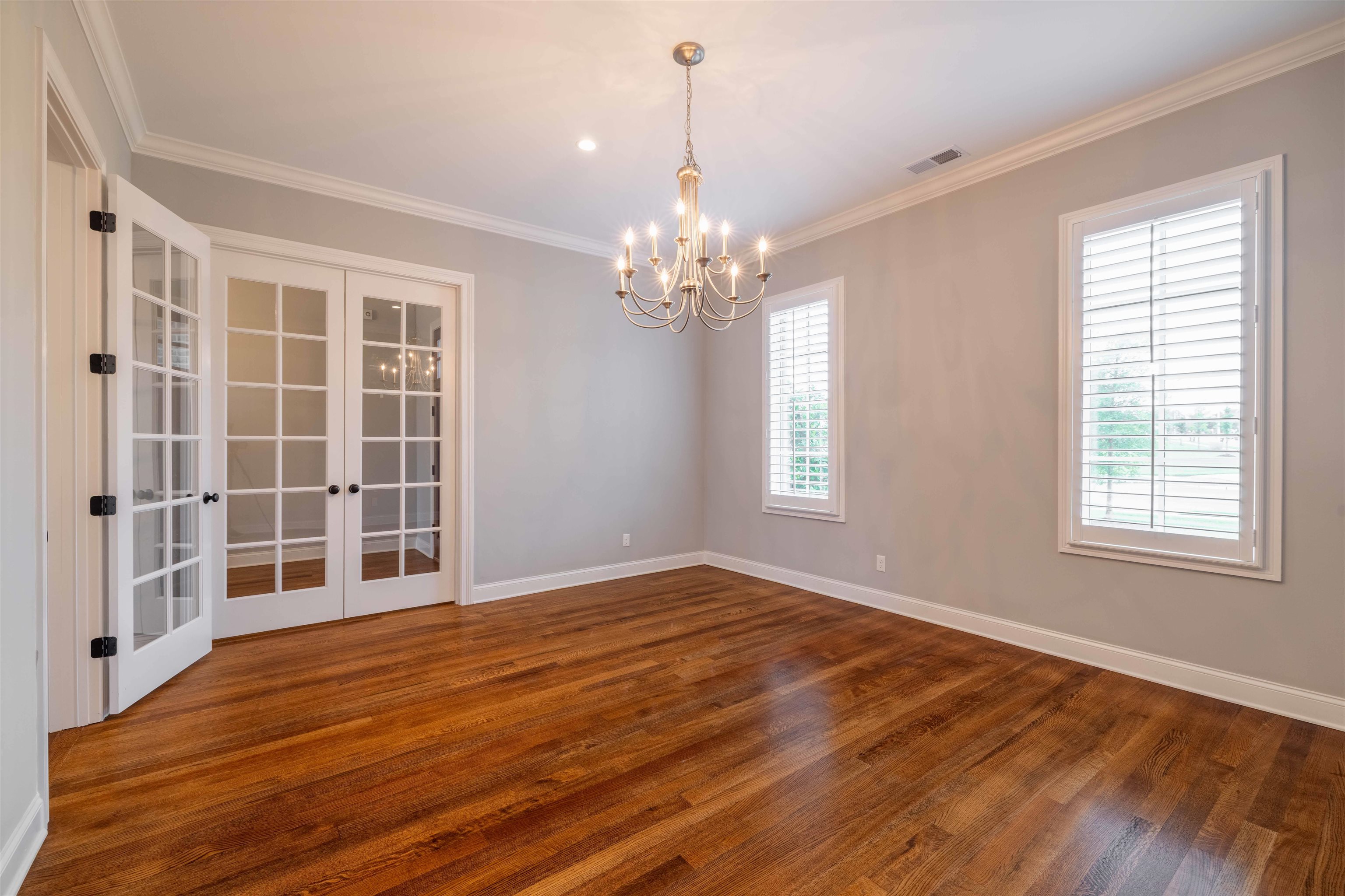 1272 Percheron Pass Collierville, TN 38017 - Photo 15 of 24 a view of empty room with wooden floor and fan