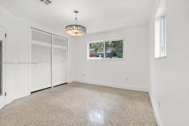 $1,050,000 | 1040 North Royal Poinciana Boulevard, Miami Springs, FL 33166