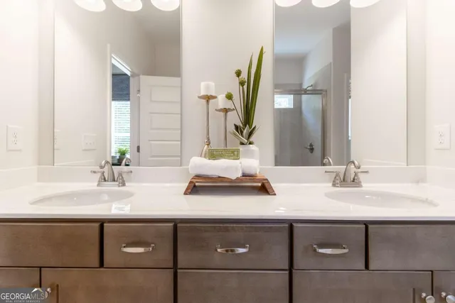 a bathroom with a sink and a mirror