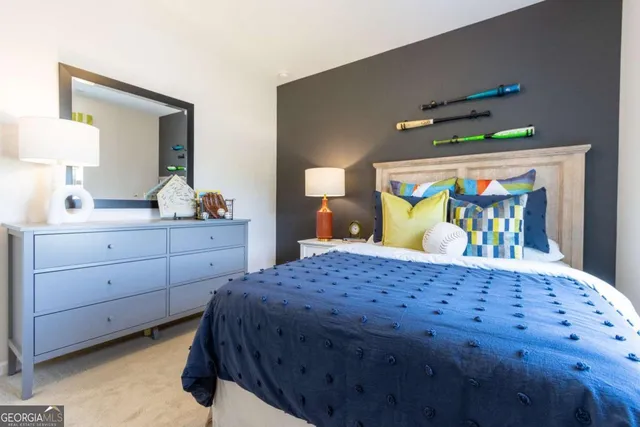 a bedroom with a bed and a dresser