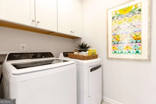 a utility room with dryer and washer