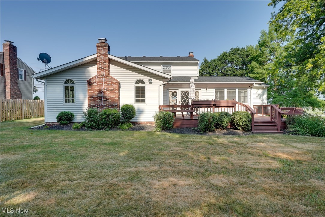 4939 Shankland Road Willoughby, OH 44094 - Photo 21 of 24 Rear view of property featuring a chimney and a wooden deck