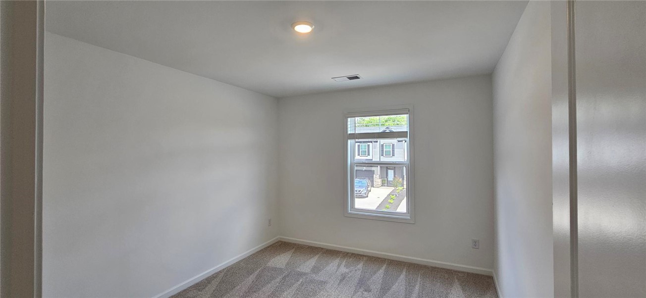 409 Belgrove Way Easley, SC 29640 - Photo 14 of 15 This bright and airy room offers a versatile space, ideal for a private office or cozy bedroom.