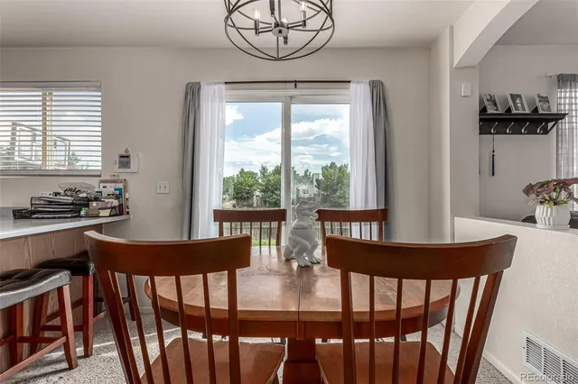a view of a dining room with furniture window and outside view
