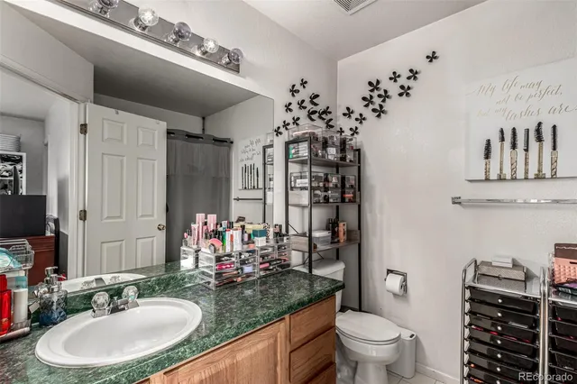 a bedroom with a bed and flat screen tv