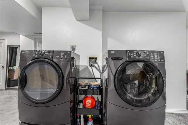 a view of a chair and tables in the balcony